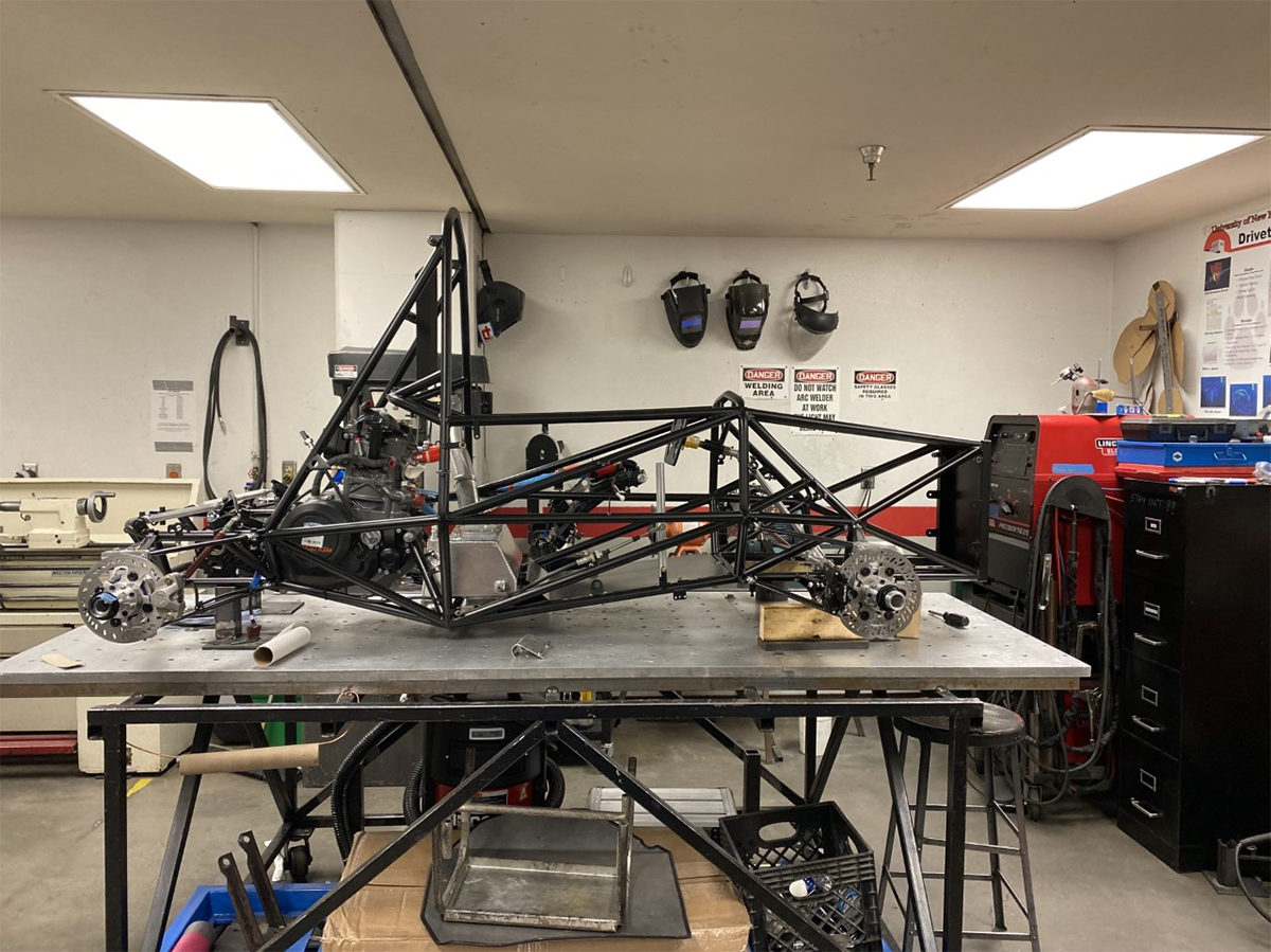 photo of an FSAE race car in the process of being assembled in a workshop
