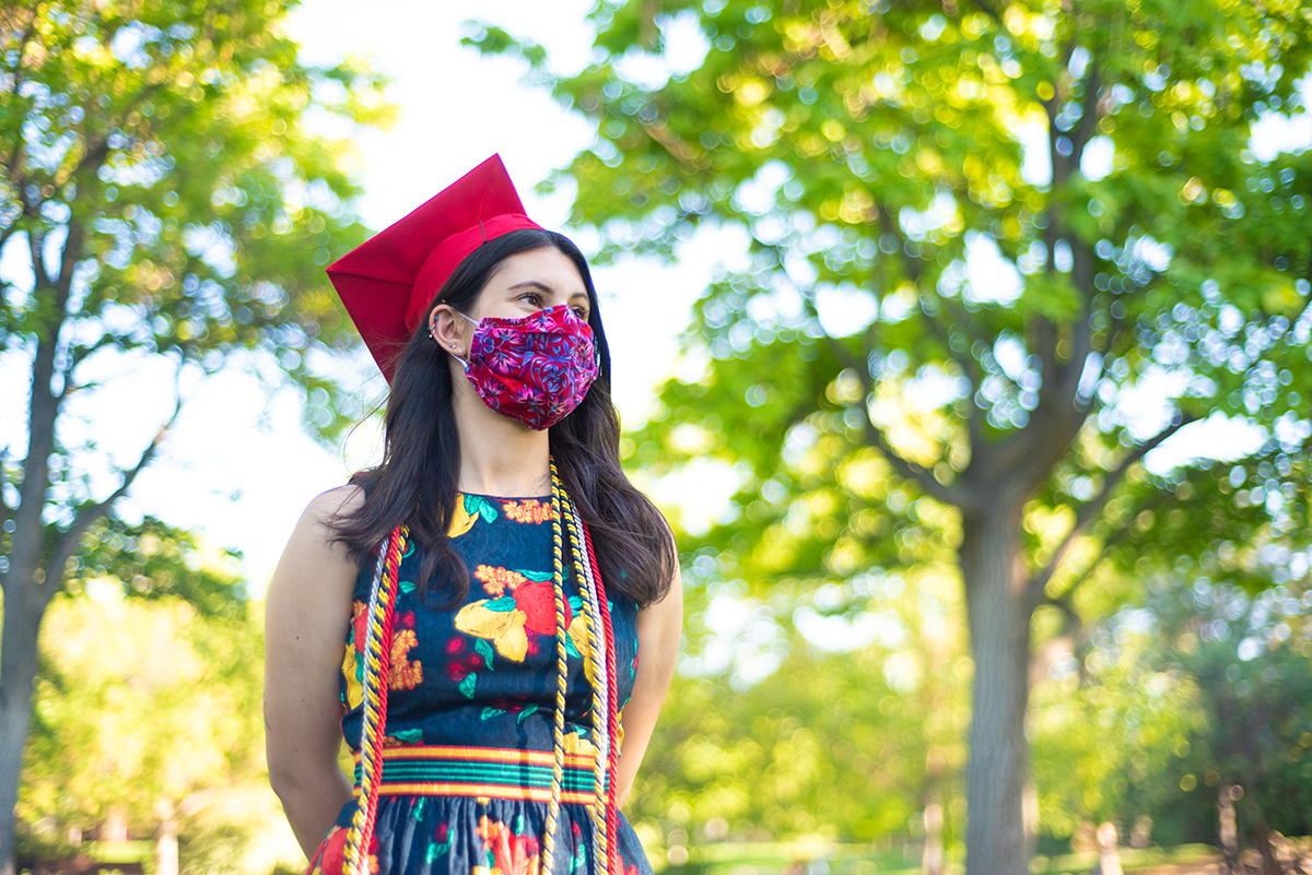 photo of a woman graduate in mask